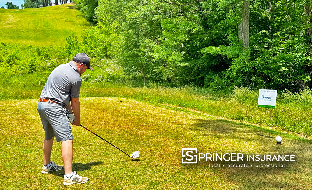 Stuart Dederer teeing off on a challenging hole!