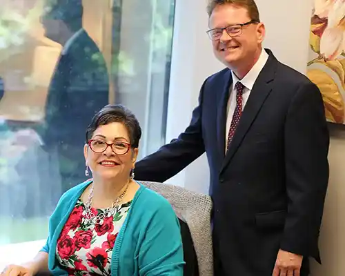 Chris Leitch Standing behind Lisa Mims 